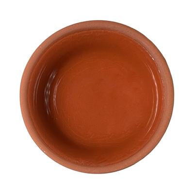 terracotta pinch bowls with an unglazed exterior and glazed interiors in orange