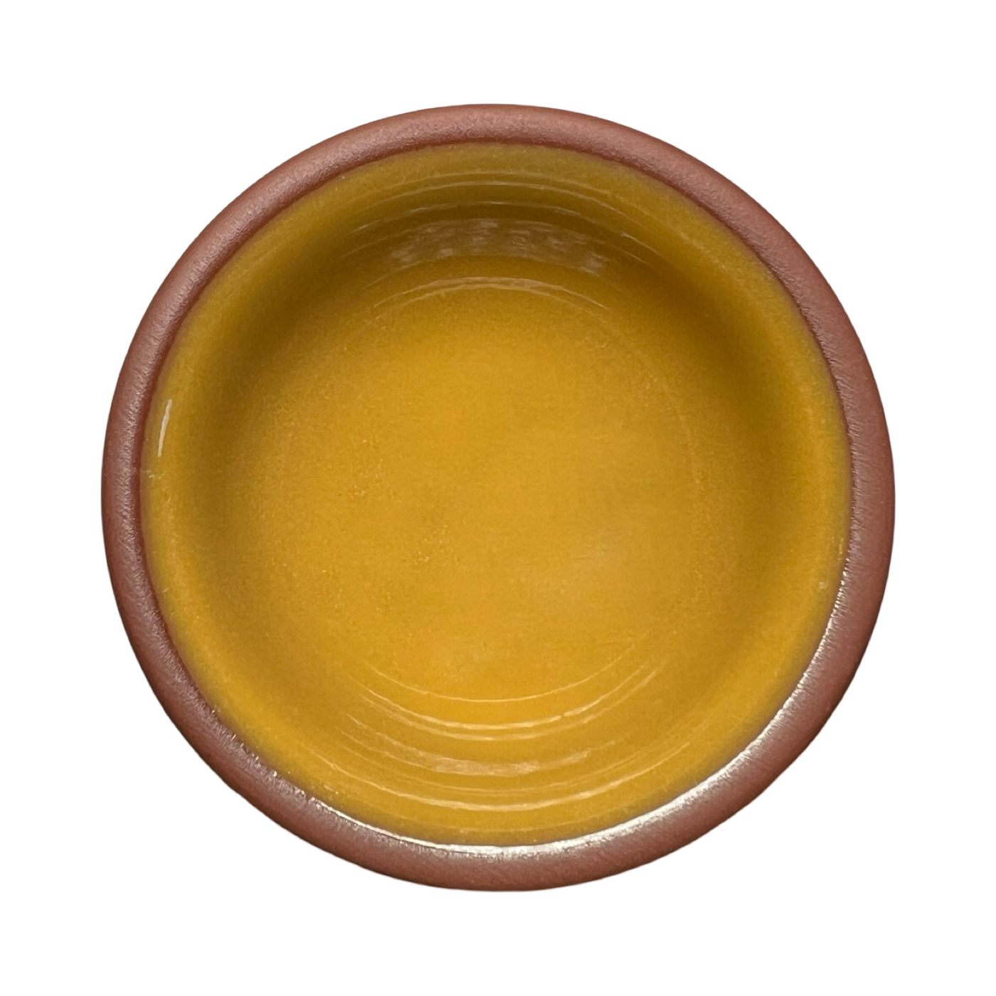 terracotta pinch bowls with an unglazed exterior and glazed interiors in yellow