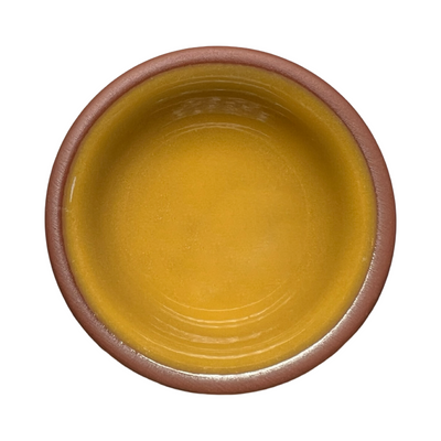 terracotta pinch bowls with an unglazed exterior and glazed interiors in yellow