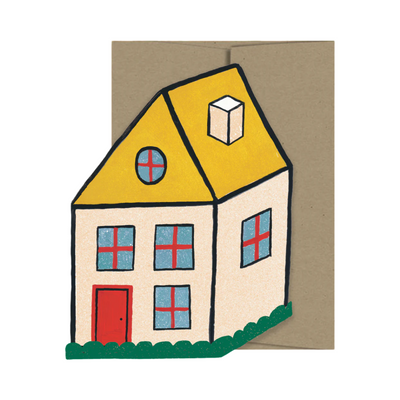 A mini greeting card shaped like a cozy house, featuring a yellow roof, red door, blue windows, and green shrubbery, paired with a kraft envelope.