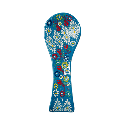 Turquoise spoon rest with a multi-color design