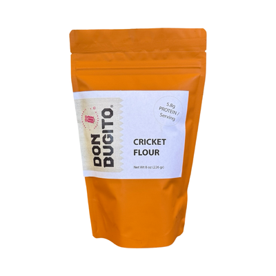 8 oz orange pouch of cricket flour with a white branded label