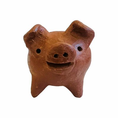 front view of red clay pig