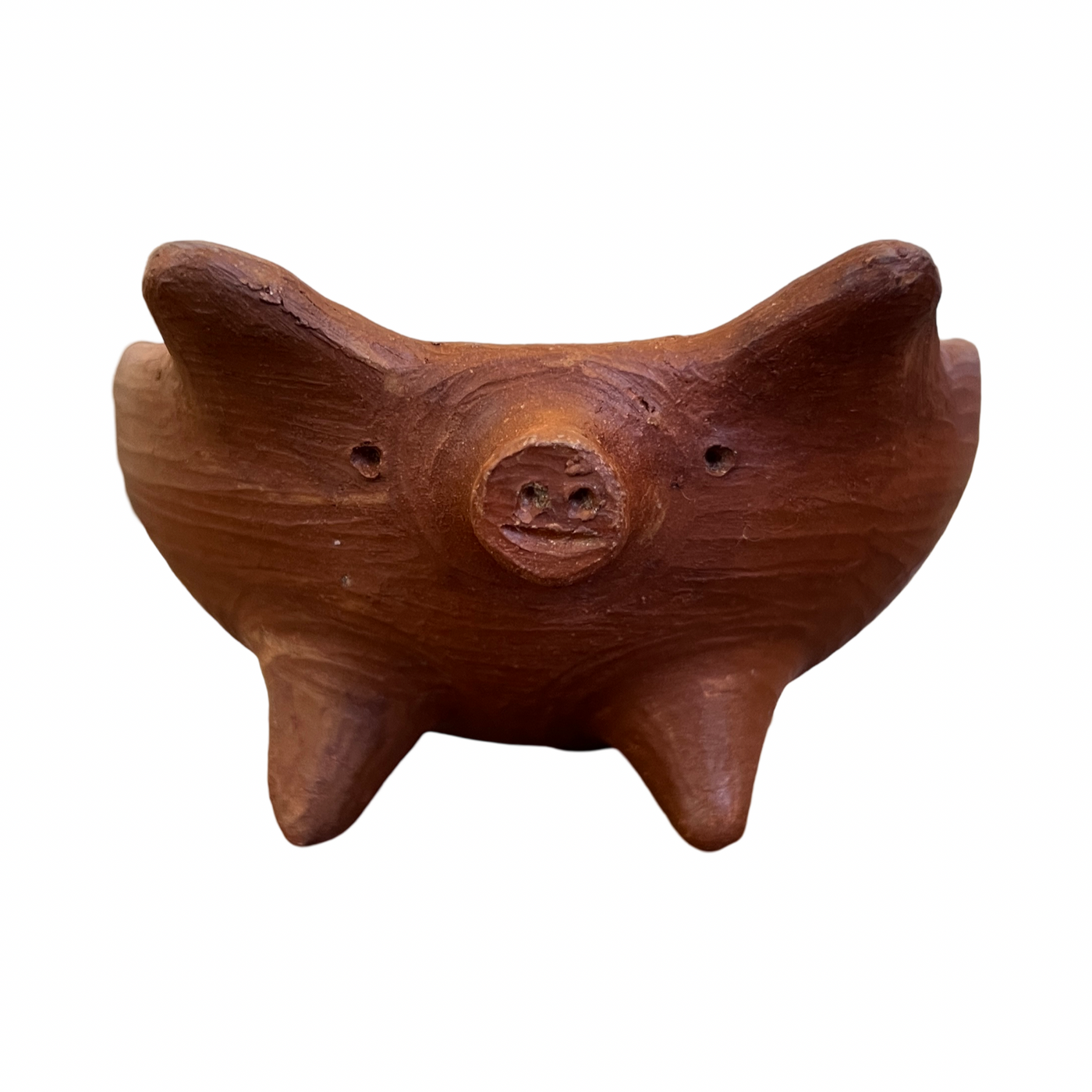 Front view of a red clay pig bowl