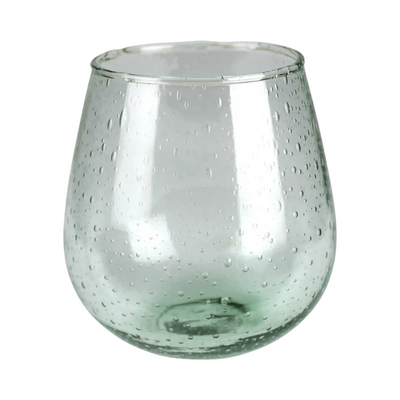 clear stemless wine glass with a green hue and features air bubbles in the glass