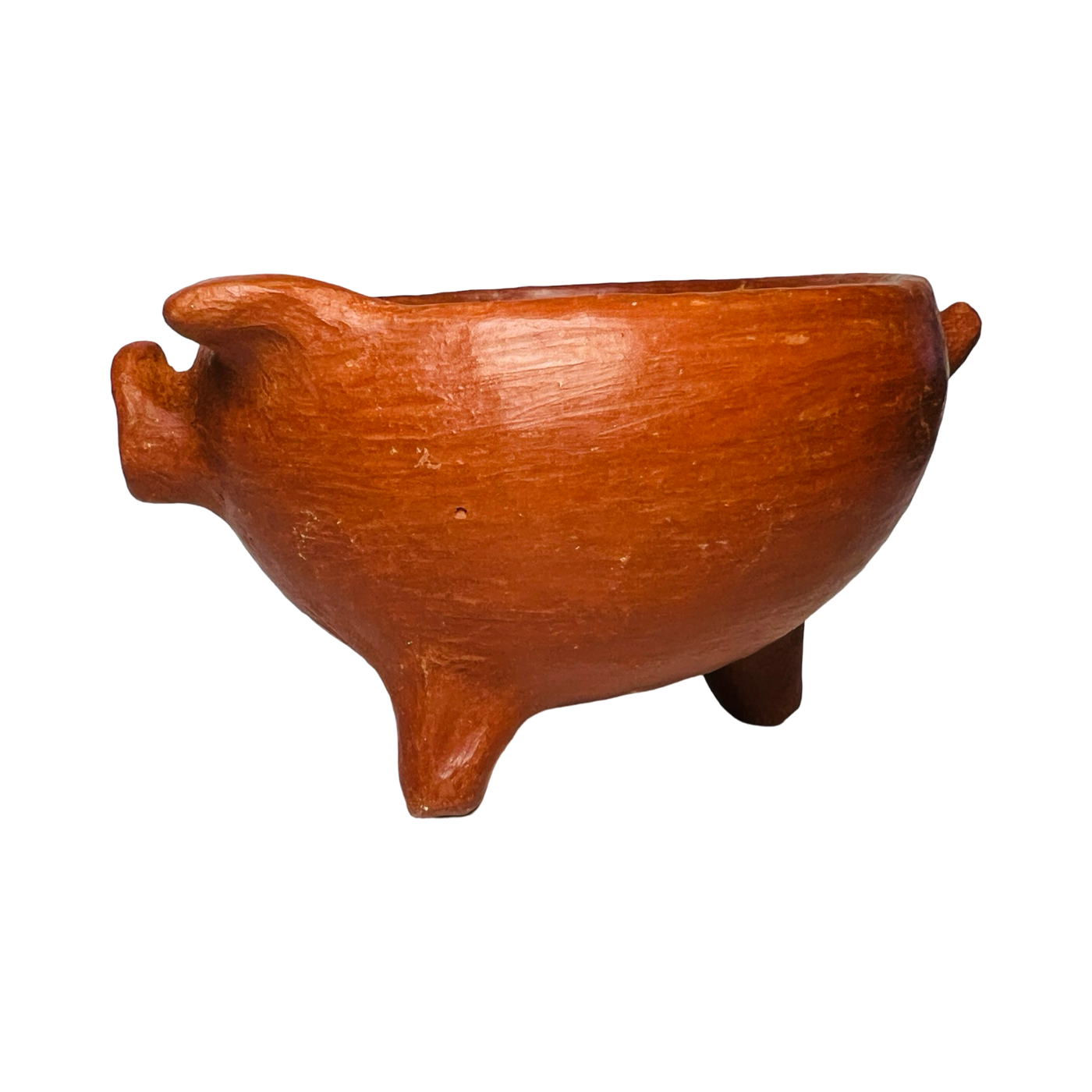 side view of a red clay pig bowl