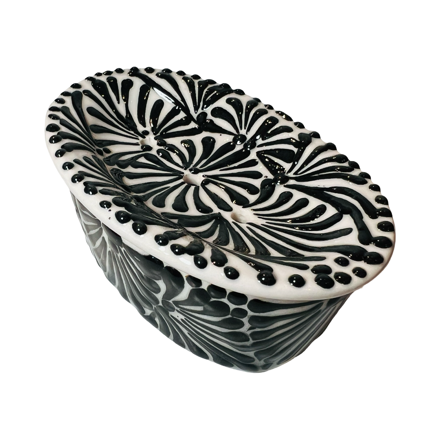 top view of a soap dish with a black and white Puebla design