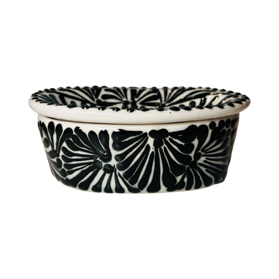 side view of a soap dish with a black and white Puebla design