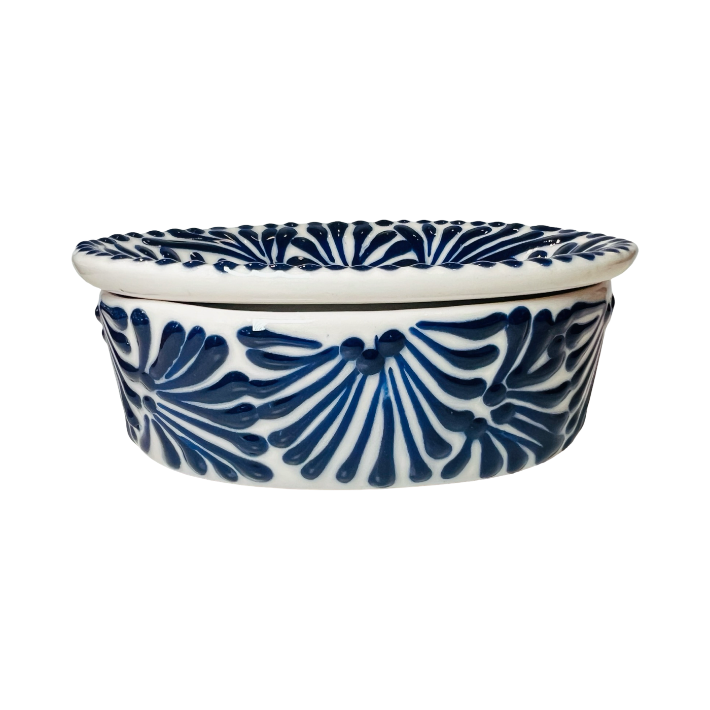 side view of a soap dish with a black and white Puebla design