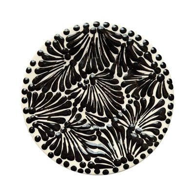 round plate with a black and white Puebla design