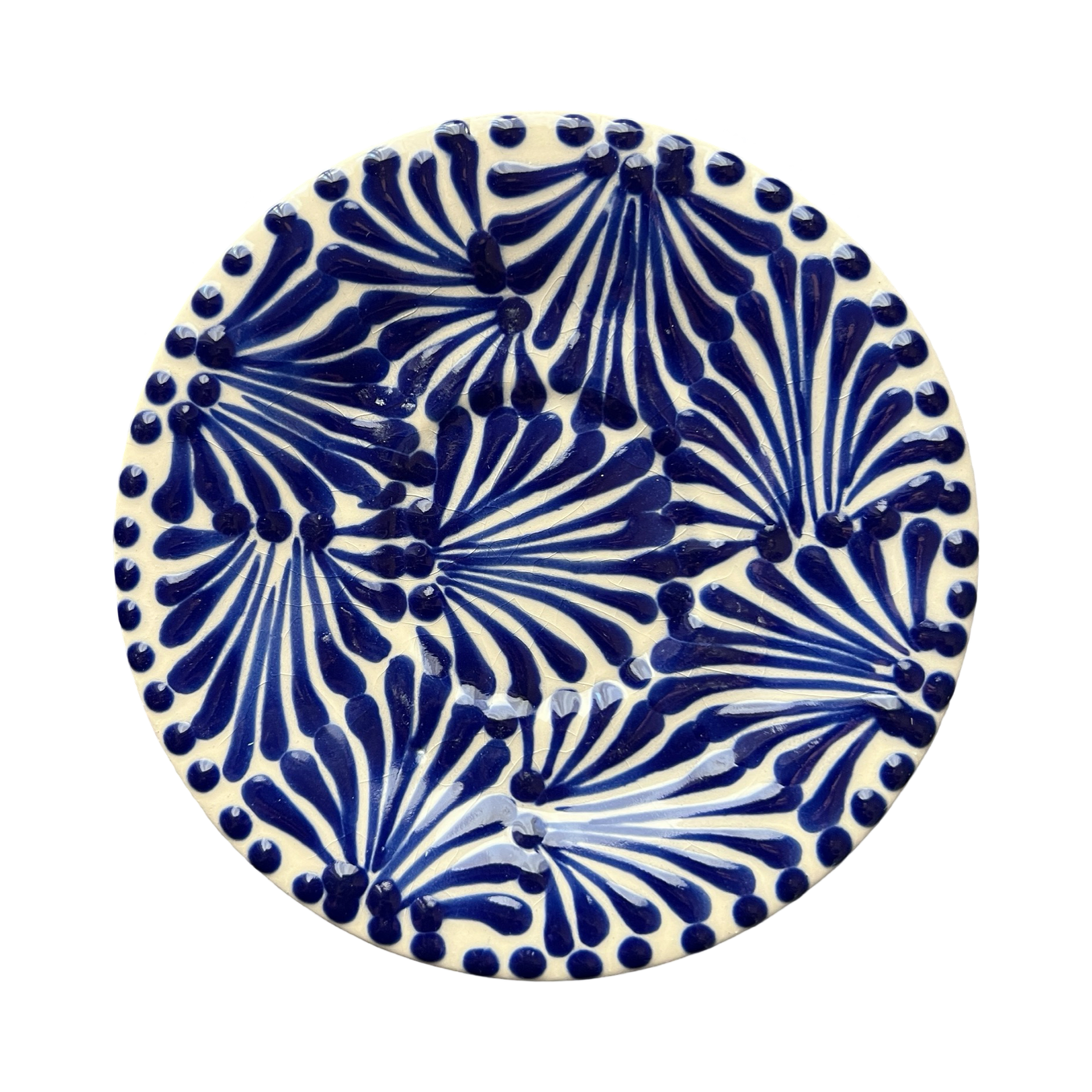 small white plate featuring a blue and white glazed design