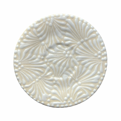 round plate with a cream and white Puebla design