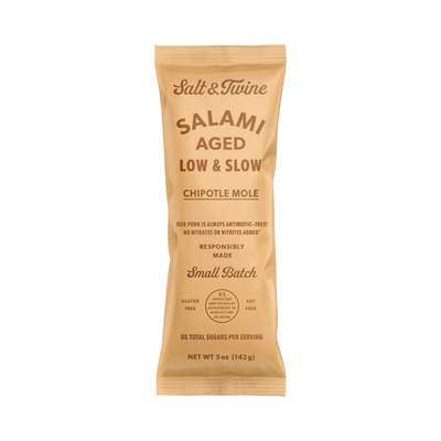 5 oz peach pouch of chipotle mole salami with brown lettering.