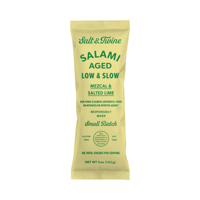5 oz yellow pouch of mezcal & salted lime salami with green lettering.
