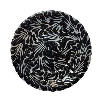 round plate with a black and gray Puebla design