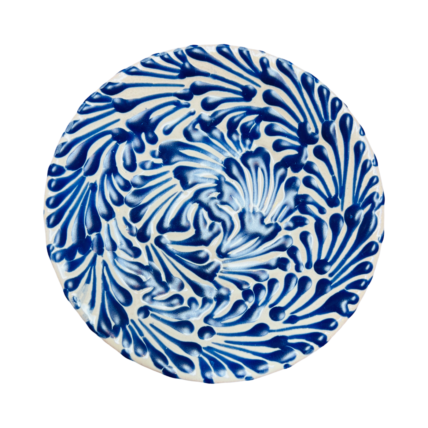 small white plate featuring a blue and white glazed design