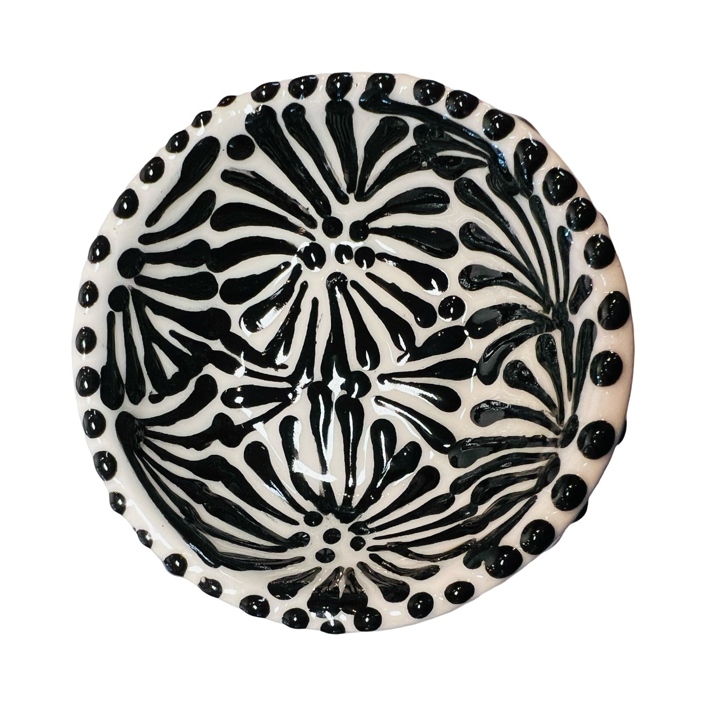 top view of a ceramic bowl in a black and white Puebla design