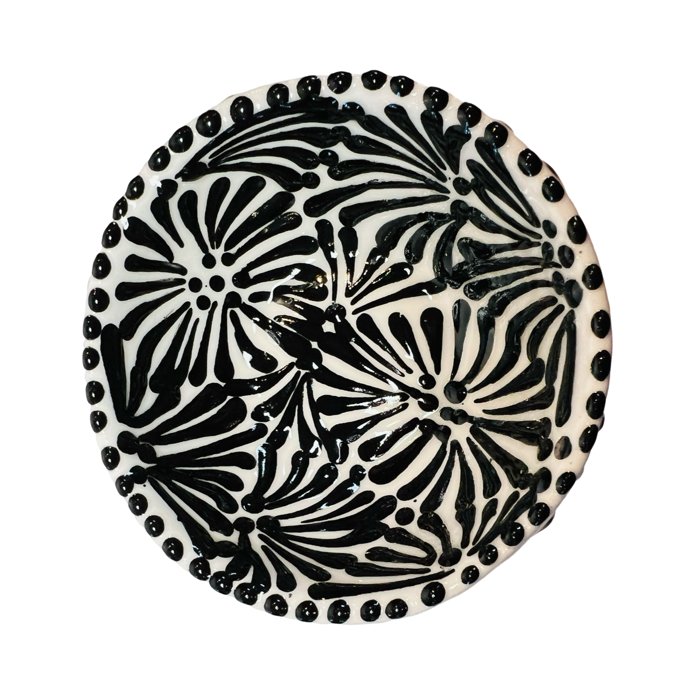 top view of a ceramic bowl in a black and white Puebla design