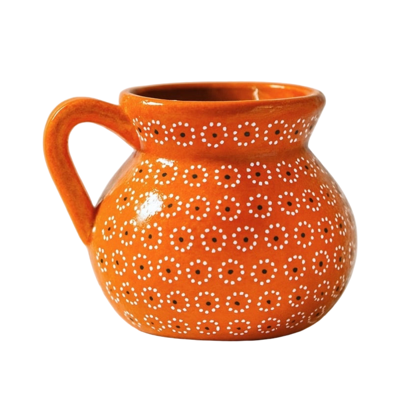 side angle of an orange colored mug with painted dots resembling the shape of a flower