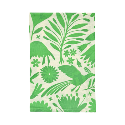 cream towel with a green otomi design folded in quarters.