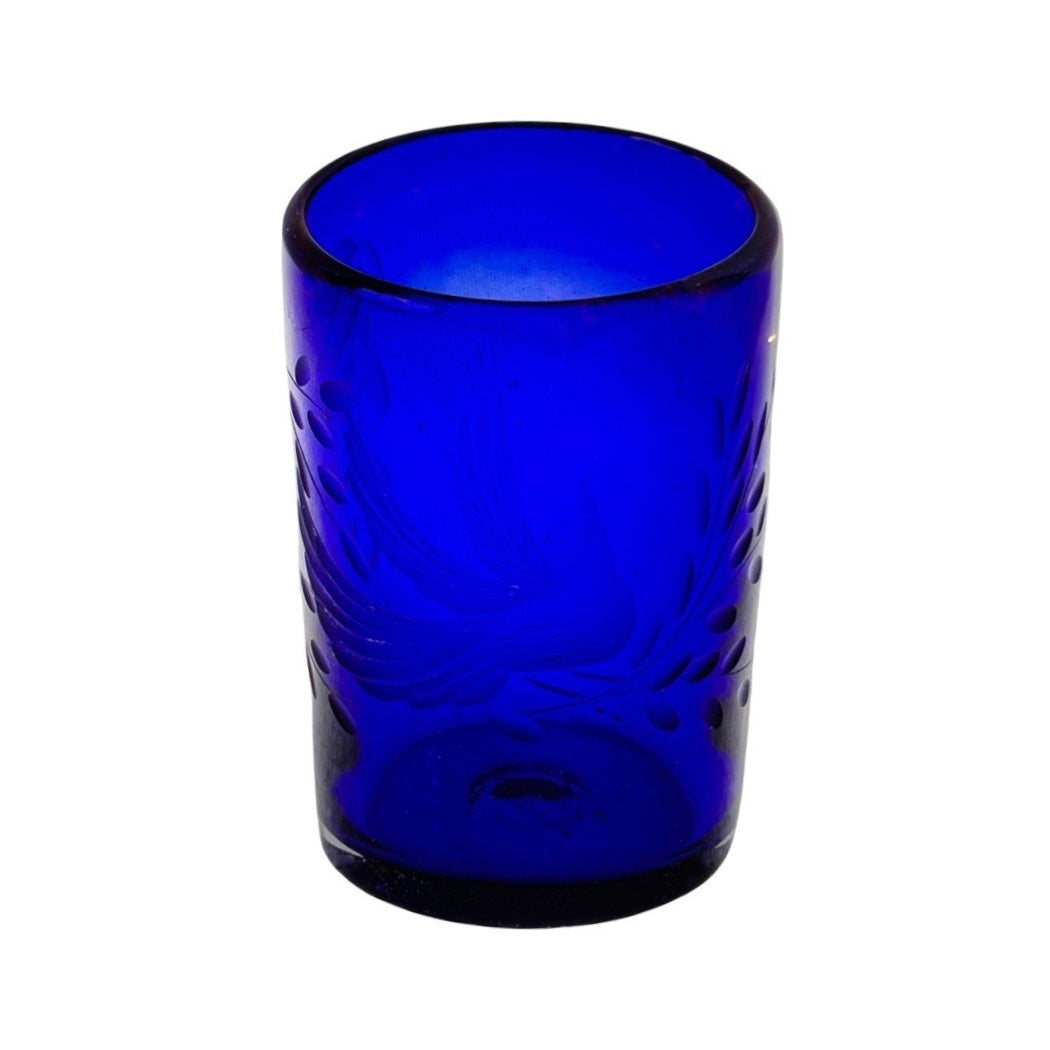 blue glass tumbler with a dove and branch motifs.