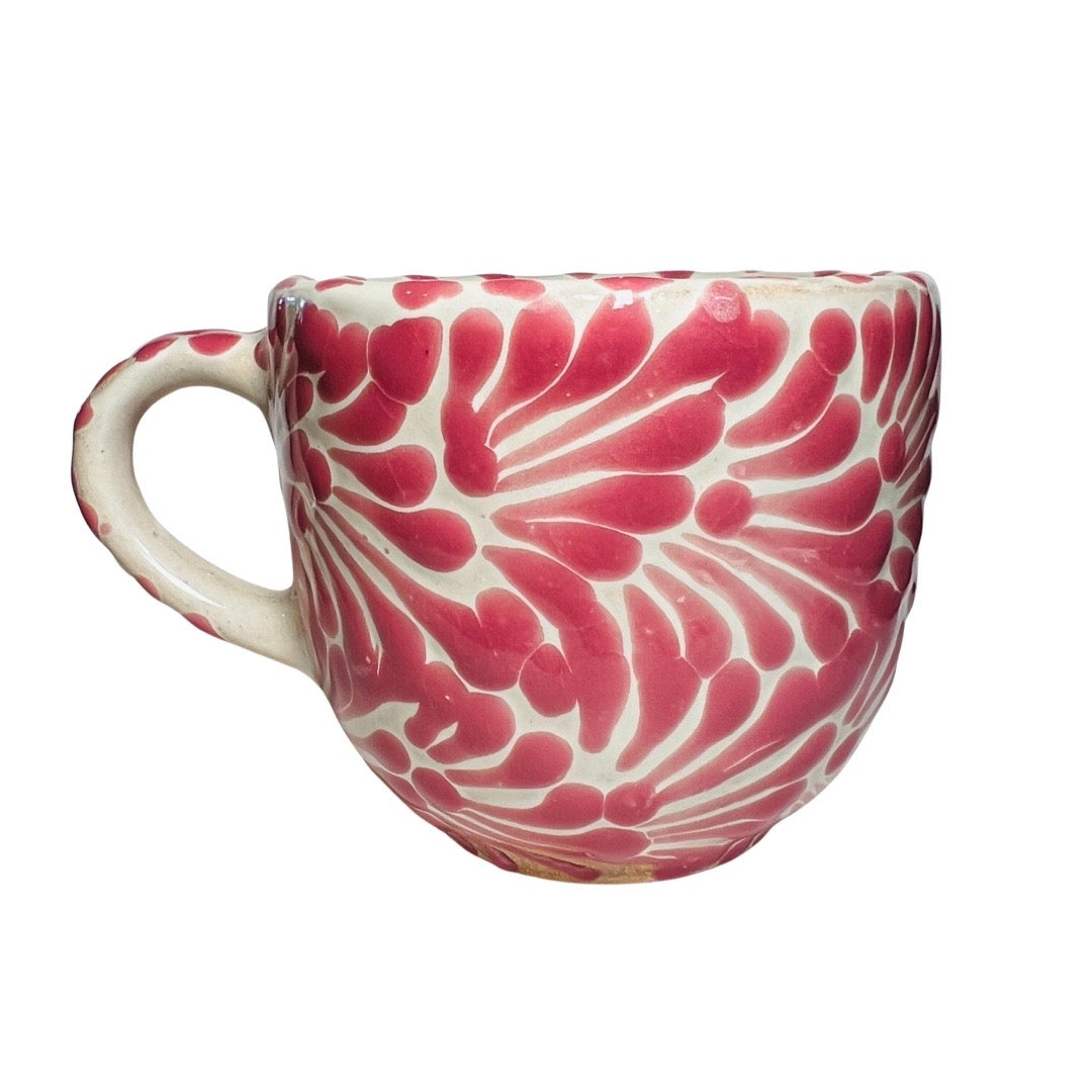 Side view of a pink and white Puebla design ceramic mug