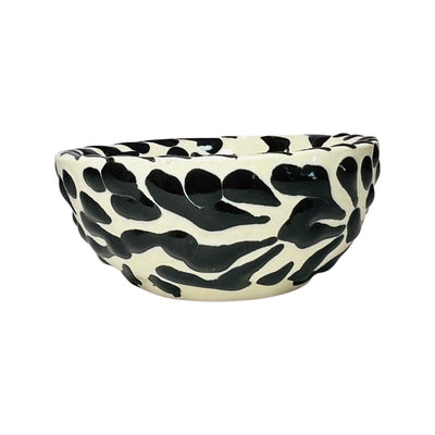 side view of a black and white Puebla design ceramic bowl