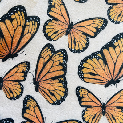close up view of a Natural towel with a monarch design