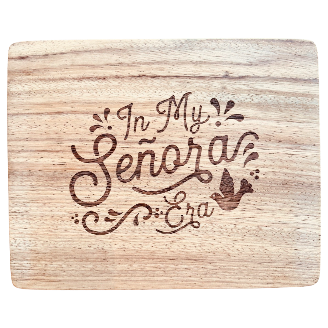 Retangular wood cutting board featuring a laser etched graphic in the center that reads "In My Señora Era"