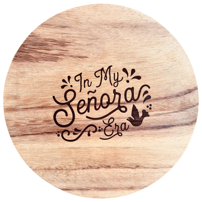 Circular wood cutting board featuring a laser etched graphic in the center that reads "In My Señora Era"
