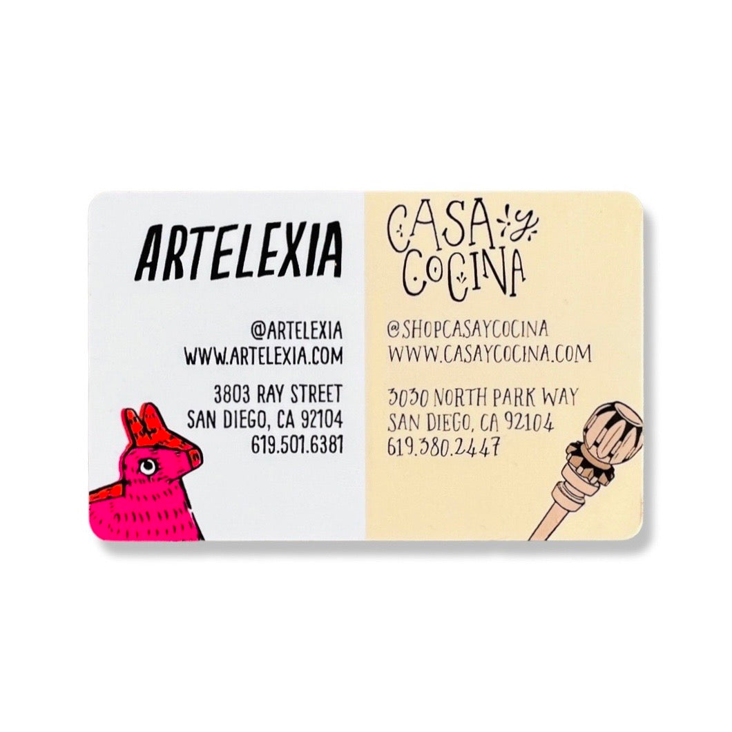 Gift card with one side advertising the information for Artelexia store and the other half advertising the information for Casa y Cocina store.