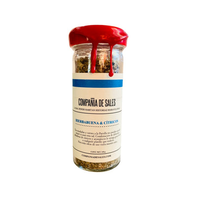 Hierbabuena & Citricos Gourmet Salt in branded bottle with cap.