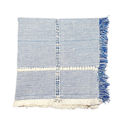 Sky Blue and natural handwoven napkin folded in quarters.