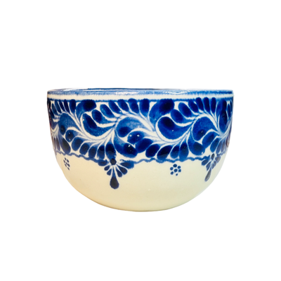 ceramic bowl with a decorative blue design near the top rim