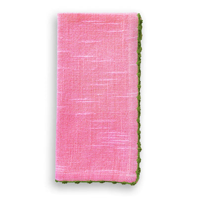 Folded berry pink cotton napkin with olive green knotted edge trim.
