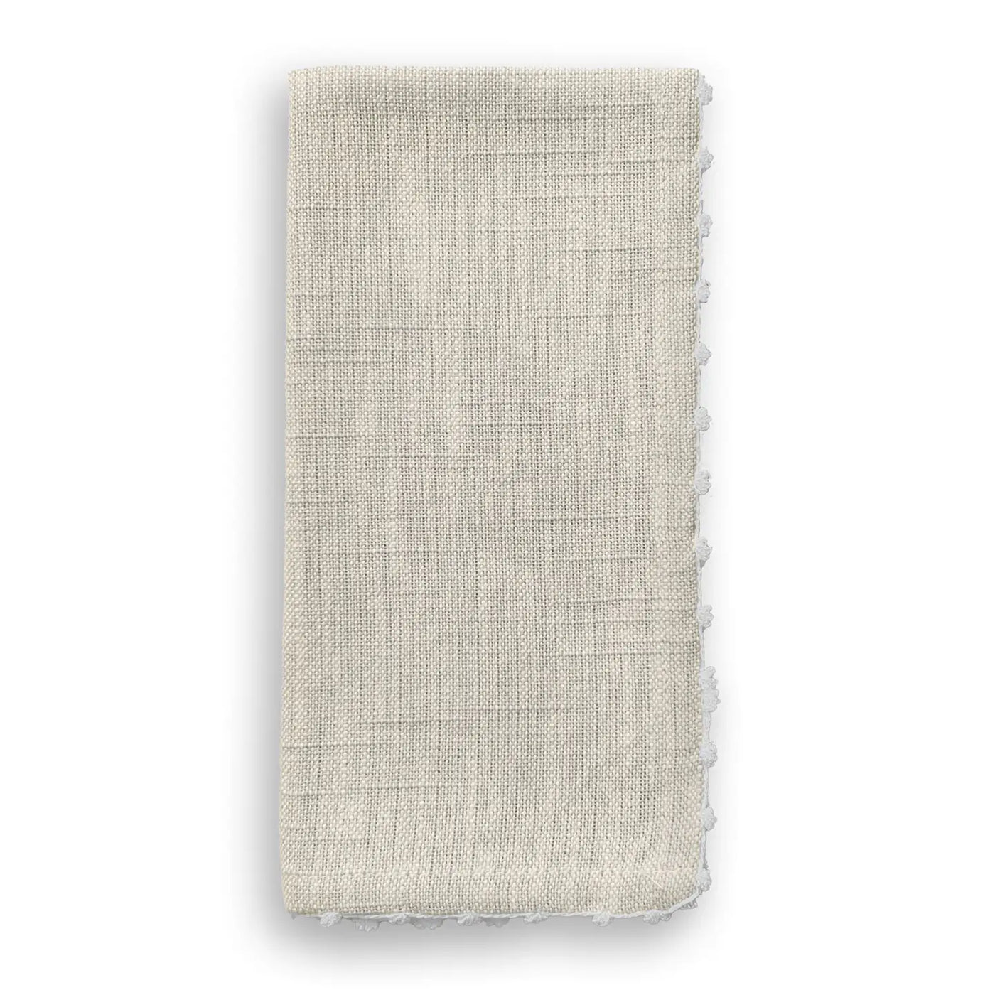 Folded natural cotton napkin with hand-knotted white trim along the edge.