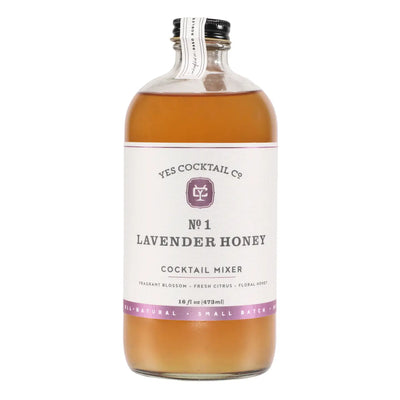 Clear glass bottle labeled “Yes Cocktail Co. No. 1 Lavender Honey Cocktail Mixer, 16 fl oz,” filled with amber liquid.
