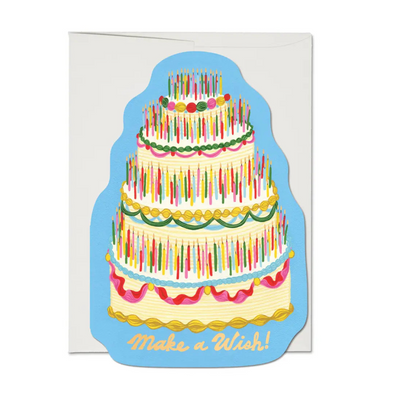 Birthday card shaped like a tall cake covered in colorful candles with the phrase “Make a Wish!” written at the bottom.