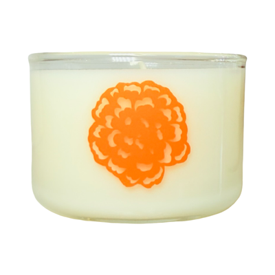 Candle with an orange floral design on a white background