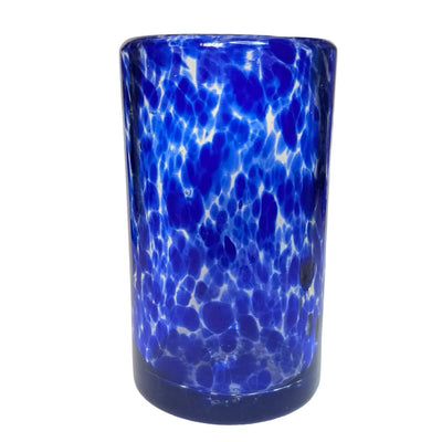 Handblown glass juice glass with a rich blue speckled design.