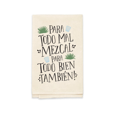 natural tea towel folded in quarters with the phrase Para Todo Mal Mezcal Para Todo Bien Tambien in black lettering features images of two glass shot glasses and two mezcal plants.