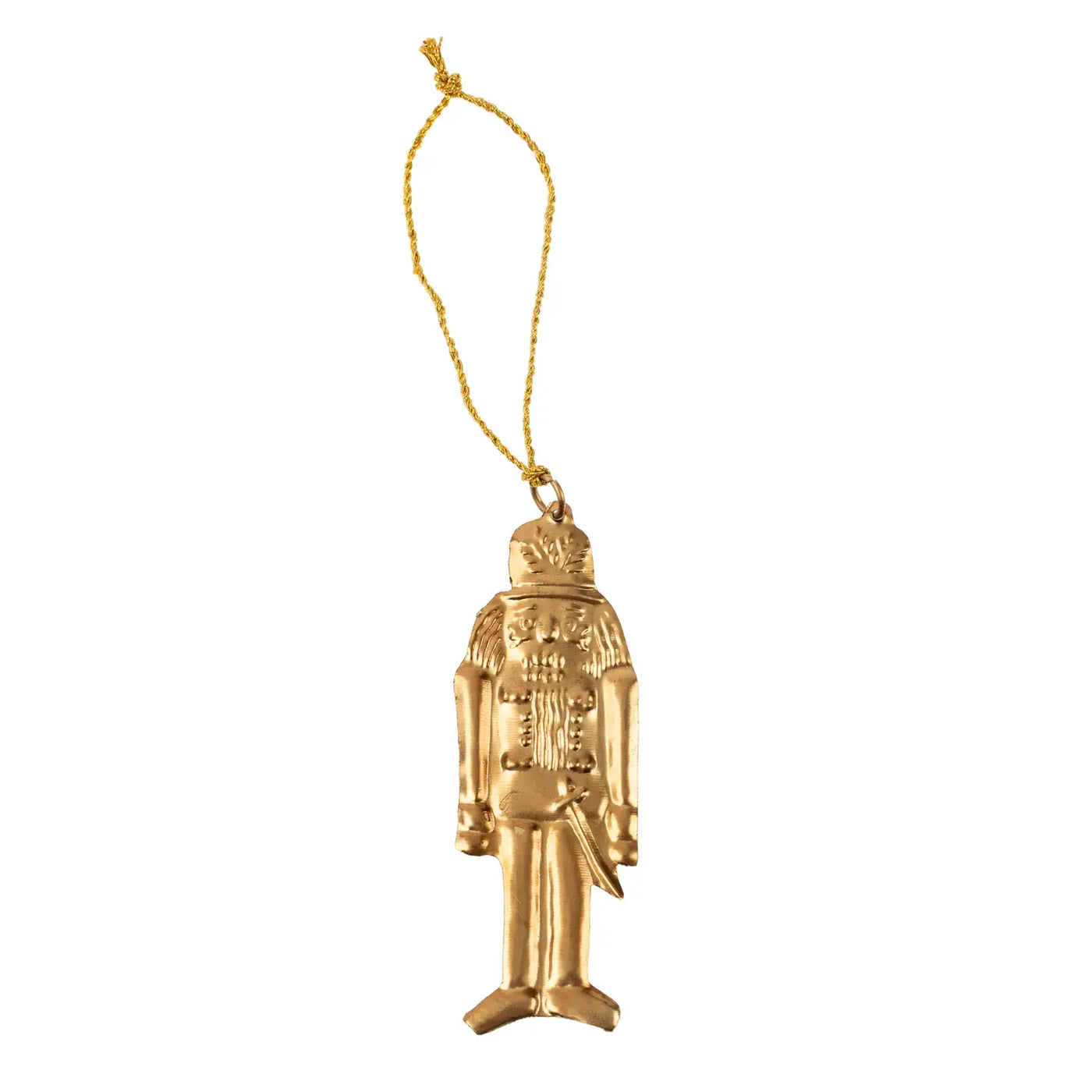 Gold-toned metal nutcracker milagro ornament with embossed details and a gold hanging string.