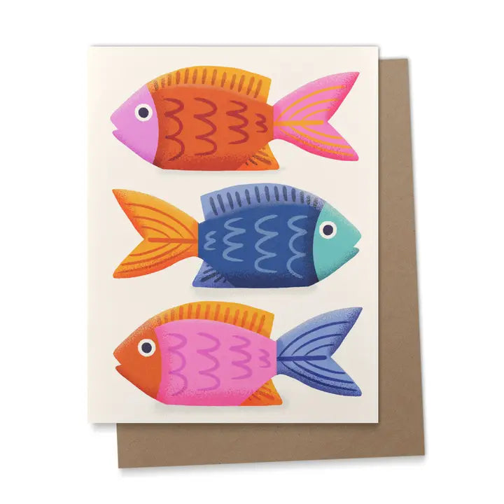 Greeting card with three colorful fish in orange, pink, blue, and yellow, illustrated in a folk-art style with a kraft envelope.