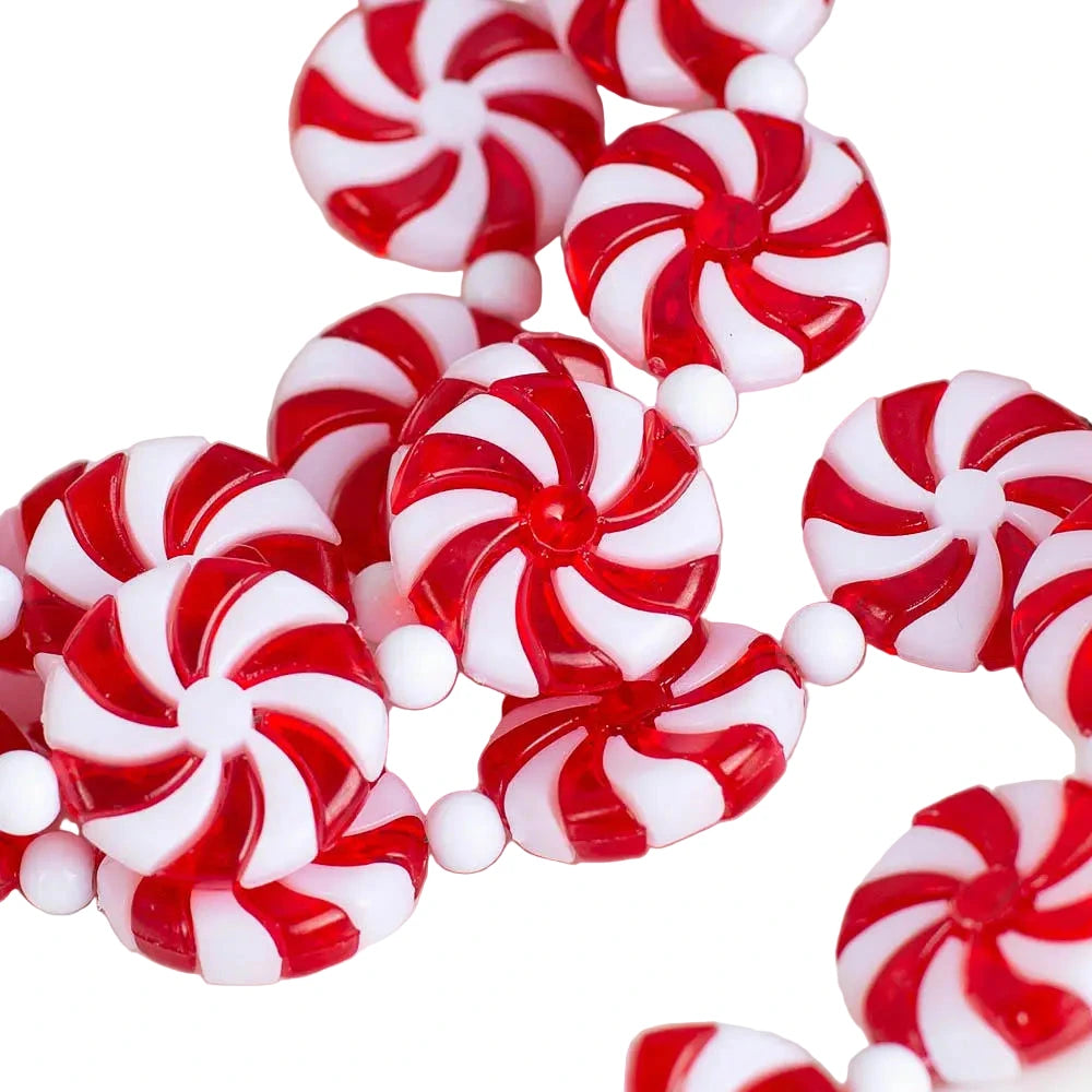 Close up view of a red and white peppermint candy–themed garland.