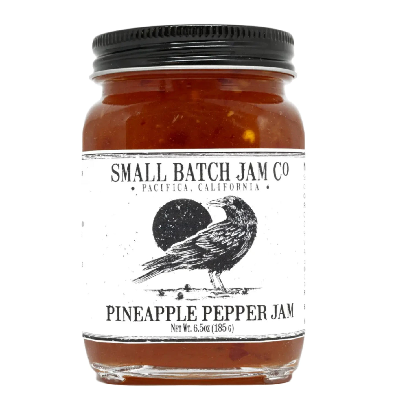 12 oz clear jar of Pineapple Pepper Jam with a black and white branded label that features a black crow.