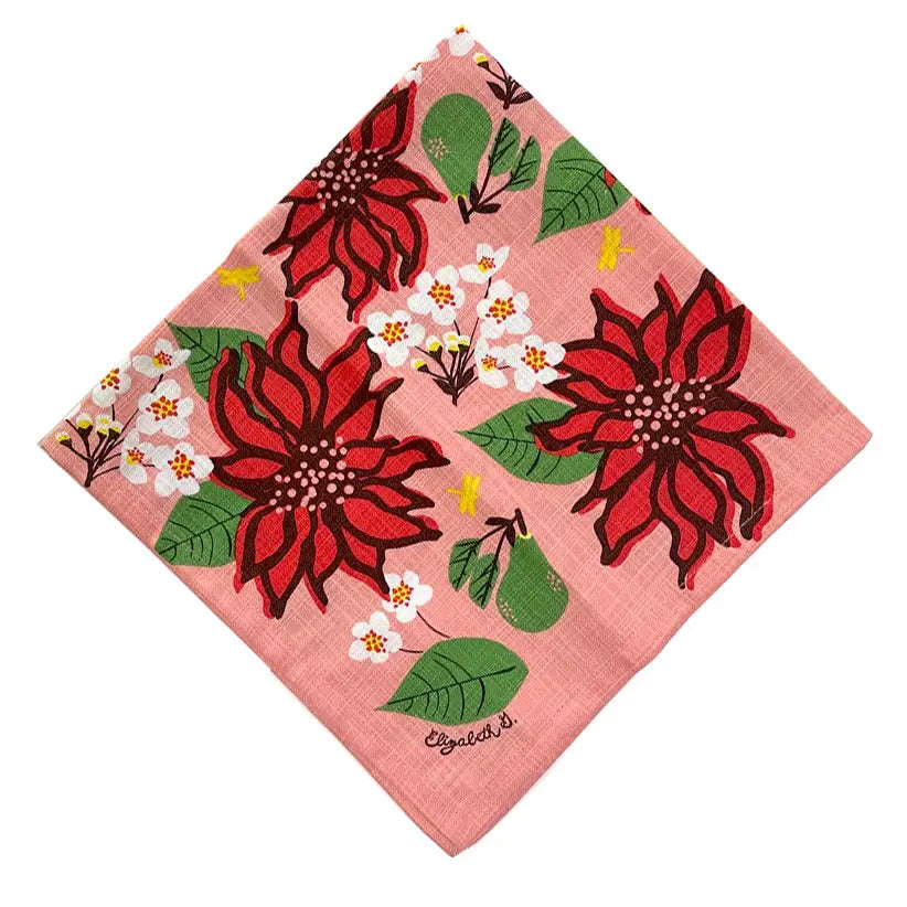 Square cloth napkin with a pink background and a poinsettia and floral print.