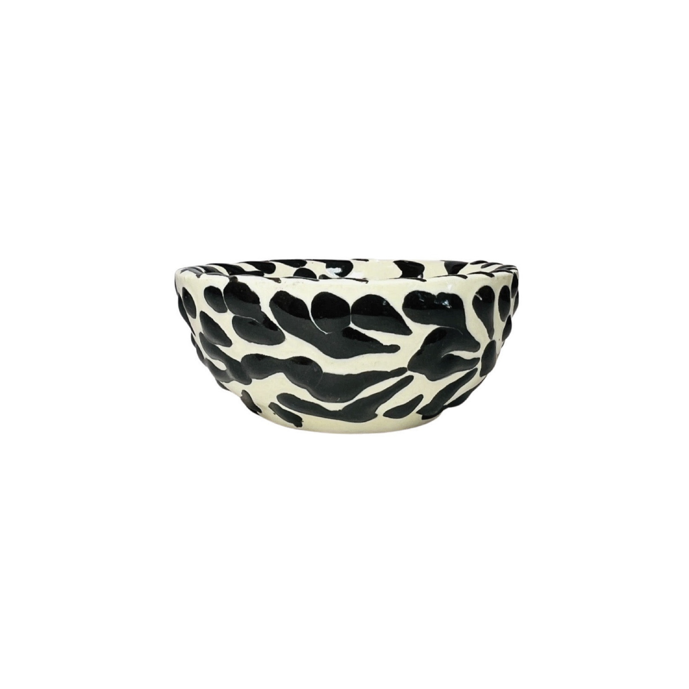 side view of a black and white Puebla design ceramic bowl