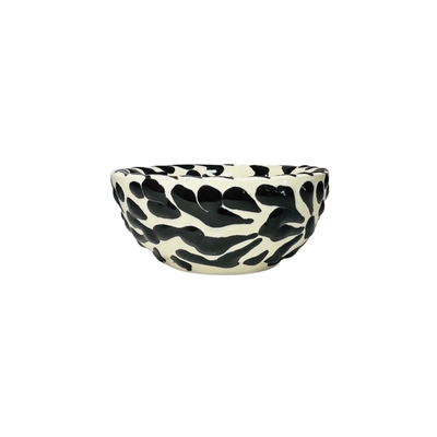 side view of a black and white Puebla design ceramic bowl