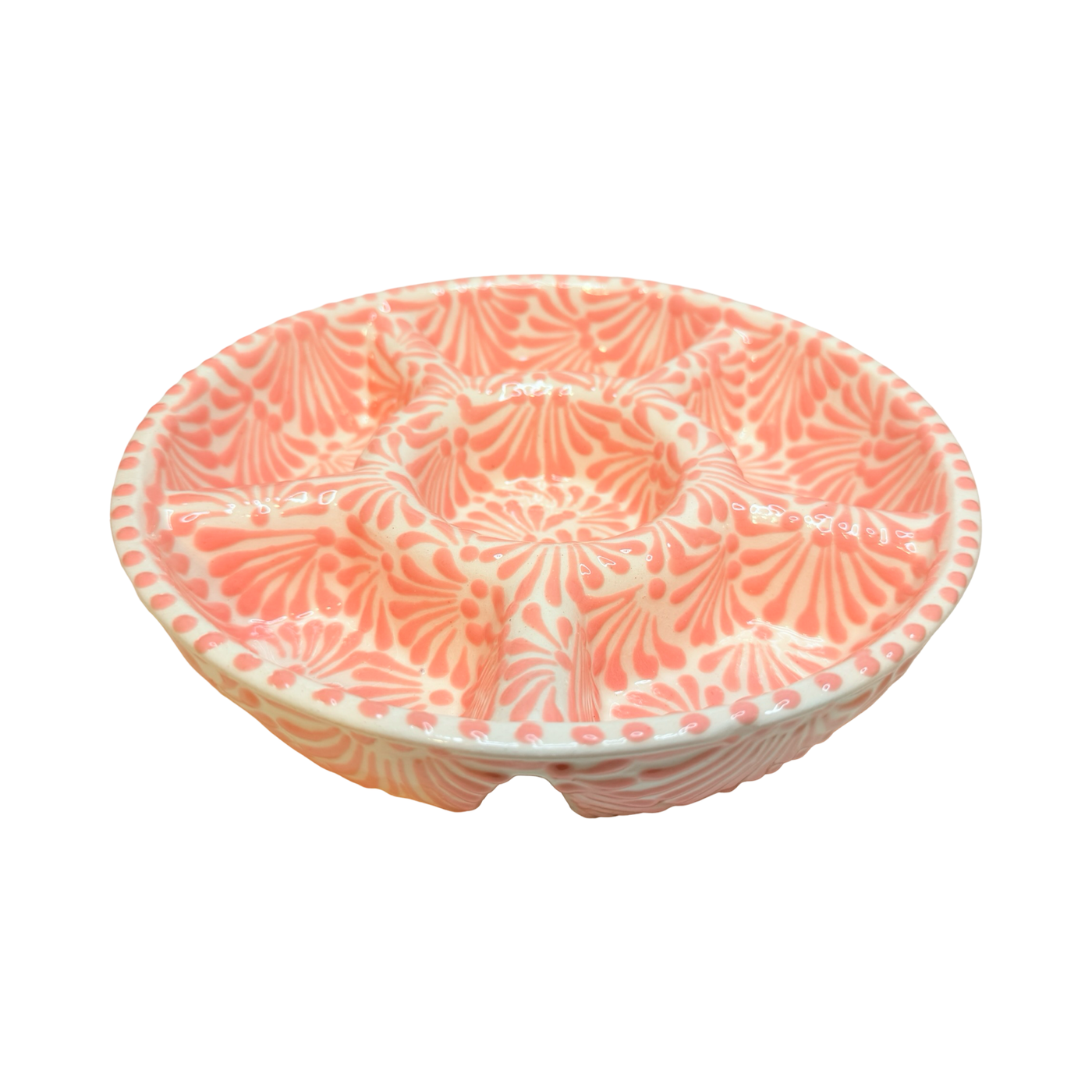 angled view of a 6-compartment round appetizer tray with a coral and white Puebla design.
