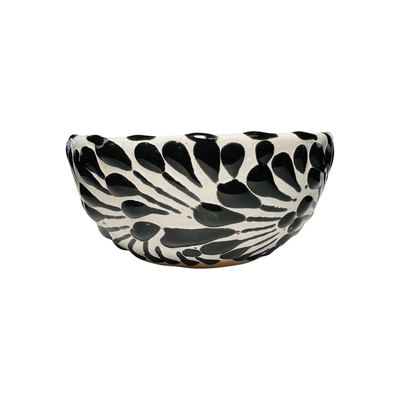 side view of a black and white Puebla design ceramic bowl